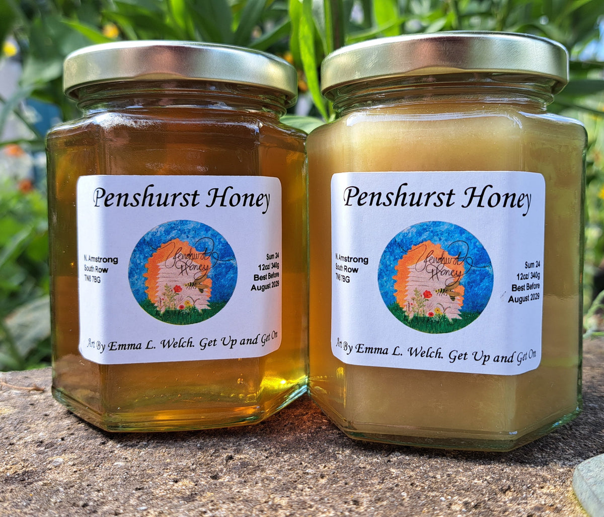 Jar of Penshurst raw honey with the Kent countryside in the background
